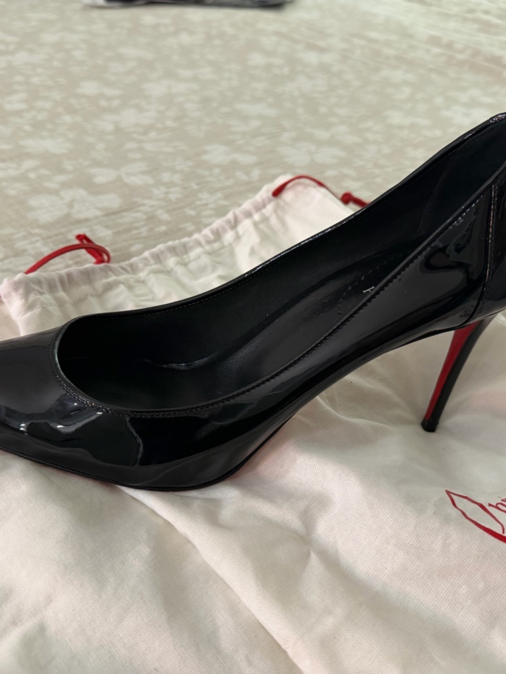 Christian Louboutin - Sporty Kate pump.  Leather Pointed Stiletto with Red Sole